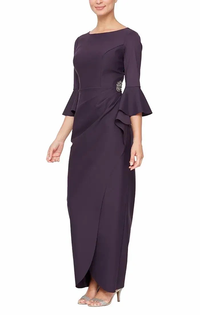 A woman wearing a long, dark purple dress with bell sleeves and a decorative side detail, standing in profile.