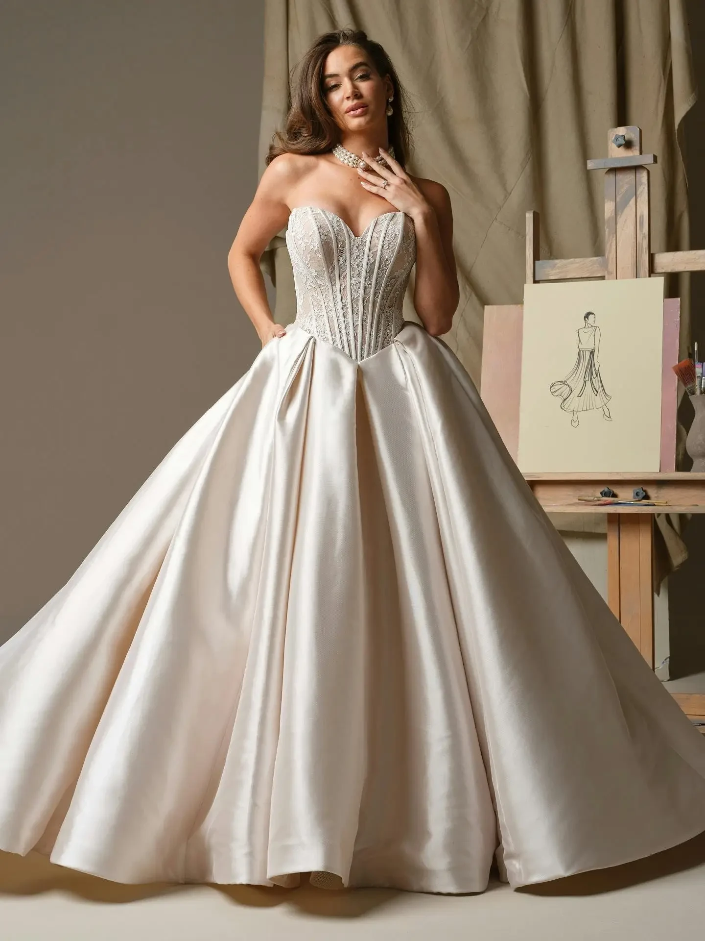 model is wearing a strapless ball gown wedding dres